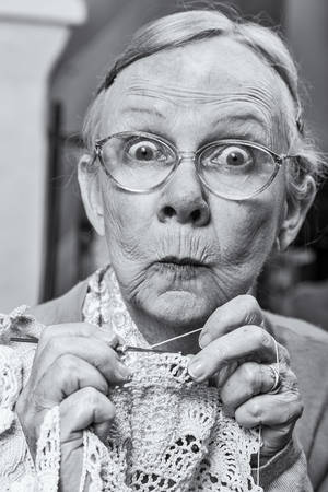 Woman with crochet and funny facial expressionの写真素材
