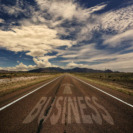 Conceptual image of desert road with the word business and arrowの写真素材