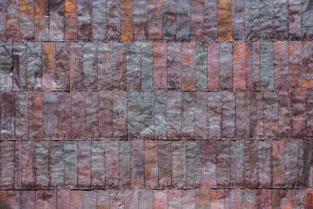 Colorful symmetrical rusted metal strip background patternの写真素材