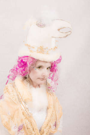 Surreal female circus style character with bird hatの写真素材