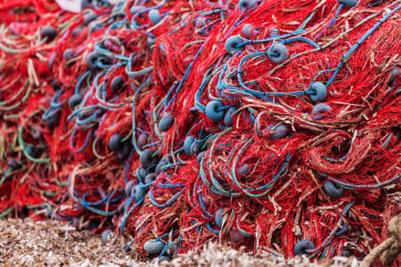 Fishing nets piled on beach at seaside near Troy in Turkeyの写真素材