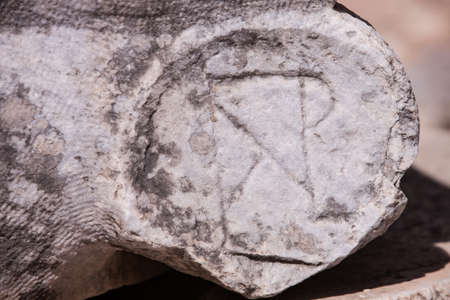 Christian symbol carved into ancient stone at Ephesus in Turkeyの写真素材