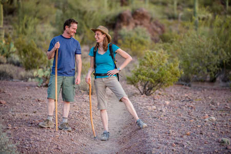 Fun couple hiking nature trail in the American Southwestの写真素材