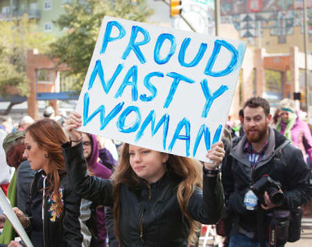 TUCSON, AZ - JANUARY 21: Female protestor holding a Proud Nasty Woman poster at the Women's March on Washington January 21, 2017 in Tucson, AZ, USA.のeditorial素材