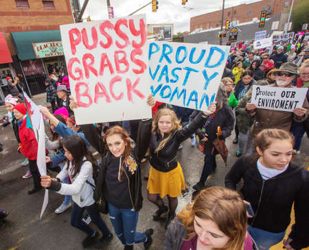 TUCSON, AZ - JANUARY 21: High angle view of various protestors holding signs as they walk at the Women's March on Washington January 21, 2017 in Tucson, AZ, USA.のeditorial素材