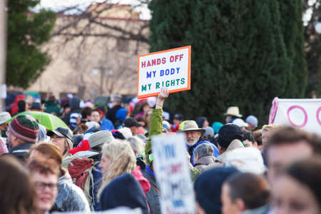 TUCSON, AZ - JANUARY 21: Unidentifiable protestor holding an abortion rights sign during the Women's March on Washington January 21, 2017 in Tucson, AZ, USA.のeditorial素材