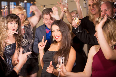 Beautiful dark haired woman dancing at a party or receptionの写真素材