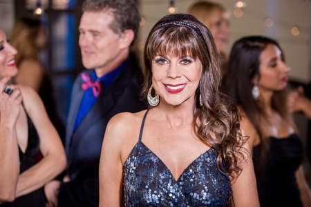 Beautiful mature woman at a partyの写真素材