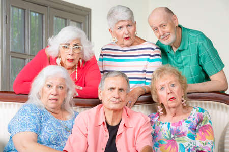 Six upset senior friends reacting in a negative wayの写真素材