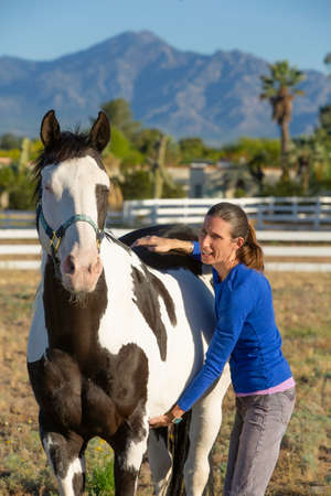 Woman performs myofascial release technique on the barrel and loinの写真素材