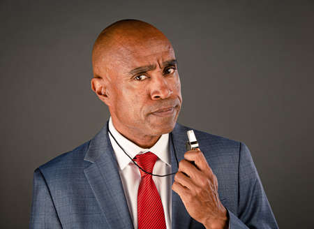 Angry male corporate or government whistleblower ready to sound outの写真素材