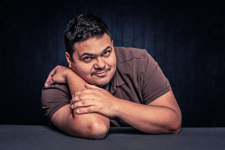 Cheerful Latino man in a casual poseの写真素材