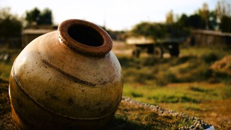 Clay water jug. Clay jug handmade isolated. Traditional pitcher. Old ceramic potの写真素材