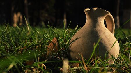Clay water jug. Clay jug handmade isolated. Traditional pitcher. Old ceramic potの写真素材