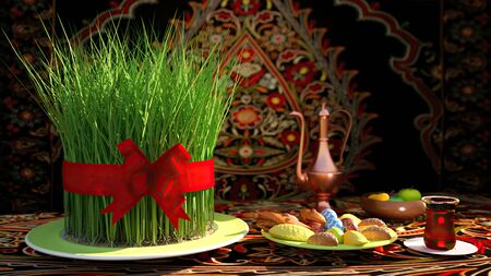 Novruz setting in Azerbaijan with black tea in armudu pear shape drinking glass with green wheat grass semeni with red ribbon for celebration.の写真素材