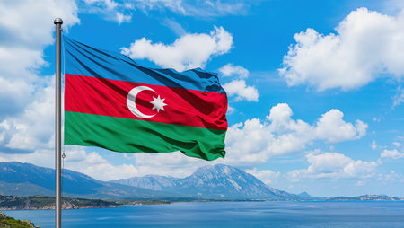 Azerbaijan flag waving in the wind against the background of the sea and mountainsの写真素材