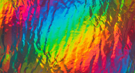 Colorful abstract background. Texture of crumpled foil close upの素材