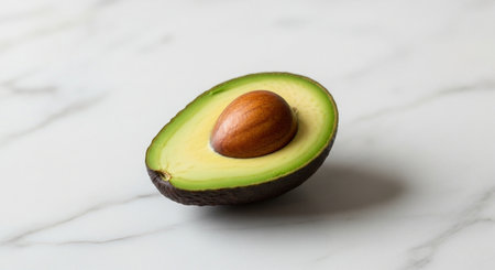 Avocado on white marble background. Close-up, selective focus.の素材