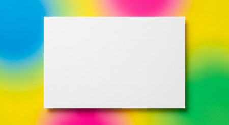 Blank white business card on colorful rainbow background. Mockup for branding identity.の素材
