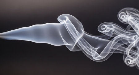 White smoke from incense sticks on a dark background. Abstract background.の素材