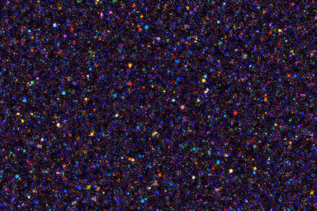 Abstract background of multicolored confetti on a black background.の素材