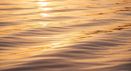 Sunset on the sea. Texture of the surface of the water.の素材