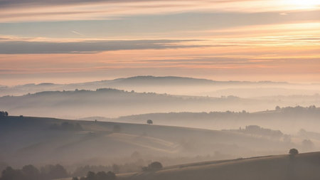 Sunrise in Tuscany, Italy. Rural landscape with fogの素材