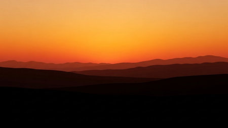 Silhouette of a mountain range at sunset in the mountains.の素材