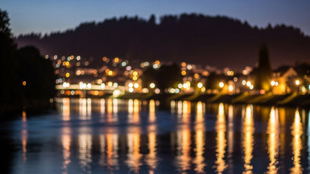 Defocused bokeh of city lights reflected in the water.の素材