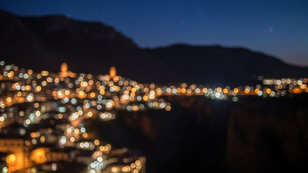Blurred city lights at night. Bokeh effect background.の素材