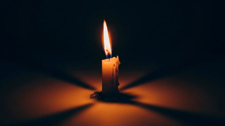 Burning candle on a dark background. Candles in the dark.の素材