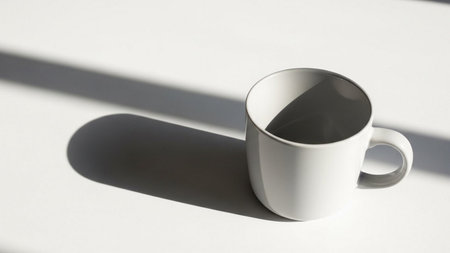 Coffee cup with shadow on white background. Minimal style.の素材
