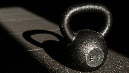 Kettlebell on a black background with shadow, close-upの素材