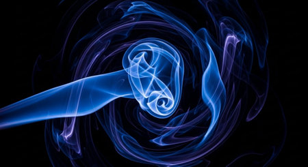 Blue smoke from incense stick on dark background. Abstract background.の素材