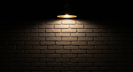 Lamp on a brick wall in the dark with copy space.の素材