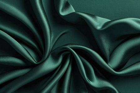 Smooth elegant green silk or satin luxury cloth texture can use as abstract background. Luxurious background designの素材