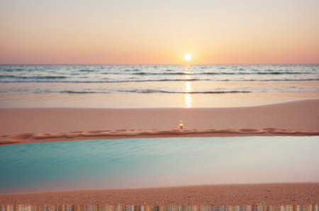 Beautiful sunset on the beach with soft wave and reflection in waterの素材