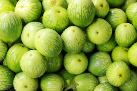 Fresh green figs for sale in the market. Close up.の写真素材