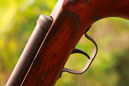 Hunting rifle close-up on a blurred background of nature.の写真素材