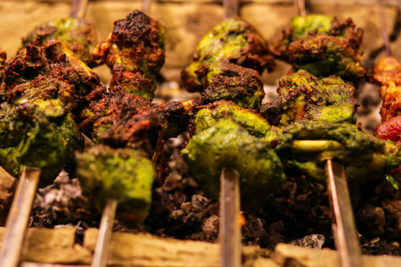Grilled chicken skewers on a barbecue grill, close-upの写真素材