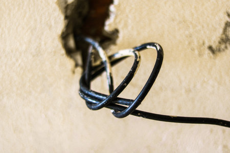 Closeup of electric cable on a wall in a building under construction