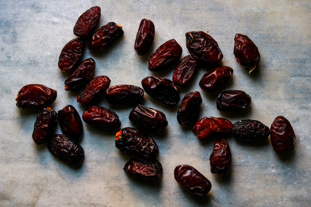 Dried dates on a marble background. Top view. Copy space.の写真素材