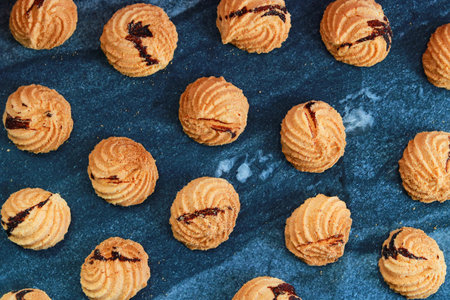 Cookies on a blue marble tile background. Top view