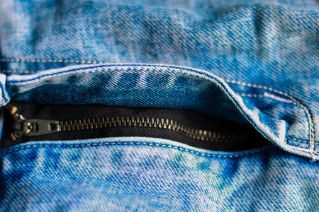 Blue jeans with zipper, close-up. Selective focus.の写真素材