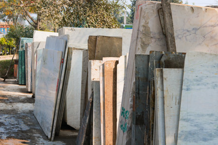 A pile of laminated floor tiles is in a factory site.の写真素材