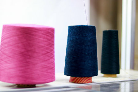 Spools of thread for sewing and embroidery on the tableの写真素材
