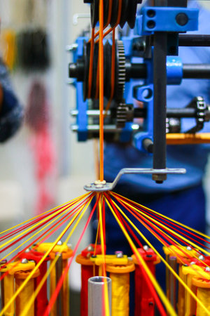 Colorful loom in a textile factory, close-up of photoの写真素材