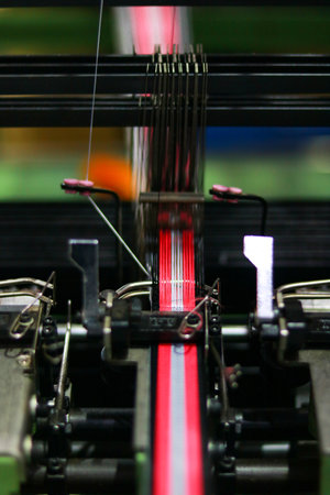 Weaving machine, detail of a loom in a textile factory