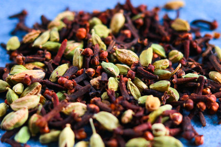 Heap of aromatic spices: cardamom, clove, coriander