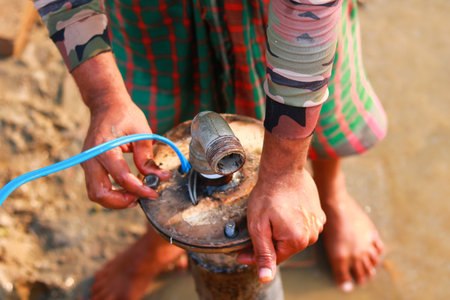 Professional installation of a deep tube well pump for groundwater extraction in a rural area